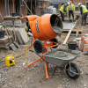 Compact Belle Minimix 150 electric cement mixer 90L with 110V transformer on studio background