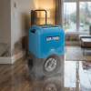 Dri-Eaz LGR 7000XLi dehumidifier drying a flooded domestic room floor after a leak
