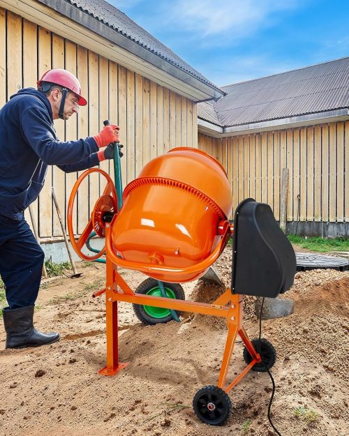 Large orange electric cement mixer with handwheel on tall stand and transport wheels, clean 140L drum in studio view